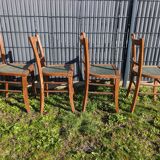 Set of four wooden bistro chairs, green seat, mid-20th century.