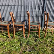 Set of four wooden bistro chairs, green seat, mid-20th century.
