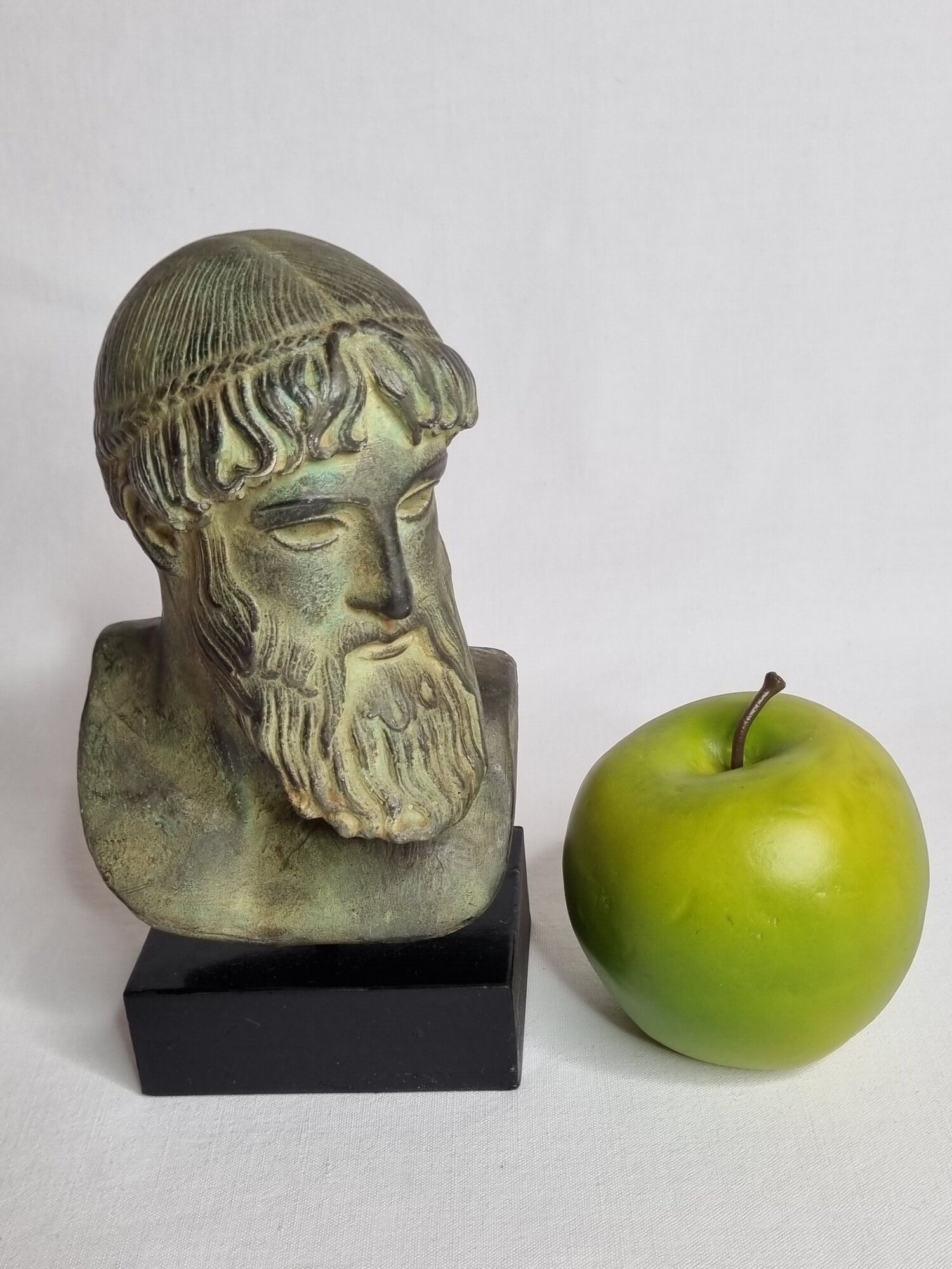 Bust of Poseidon in patinated plaster on wooden base