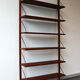 Teak and brass wall shelf by Poul Cadovius for Royal System, Denmark, 1960.