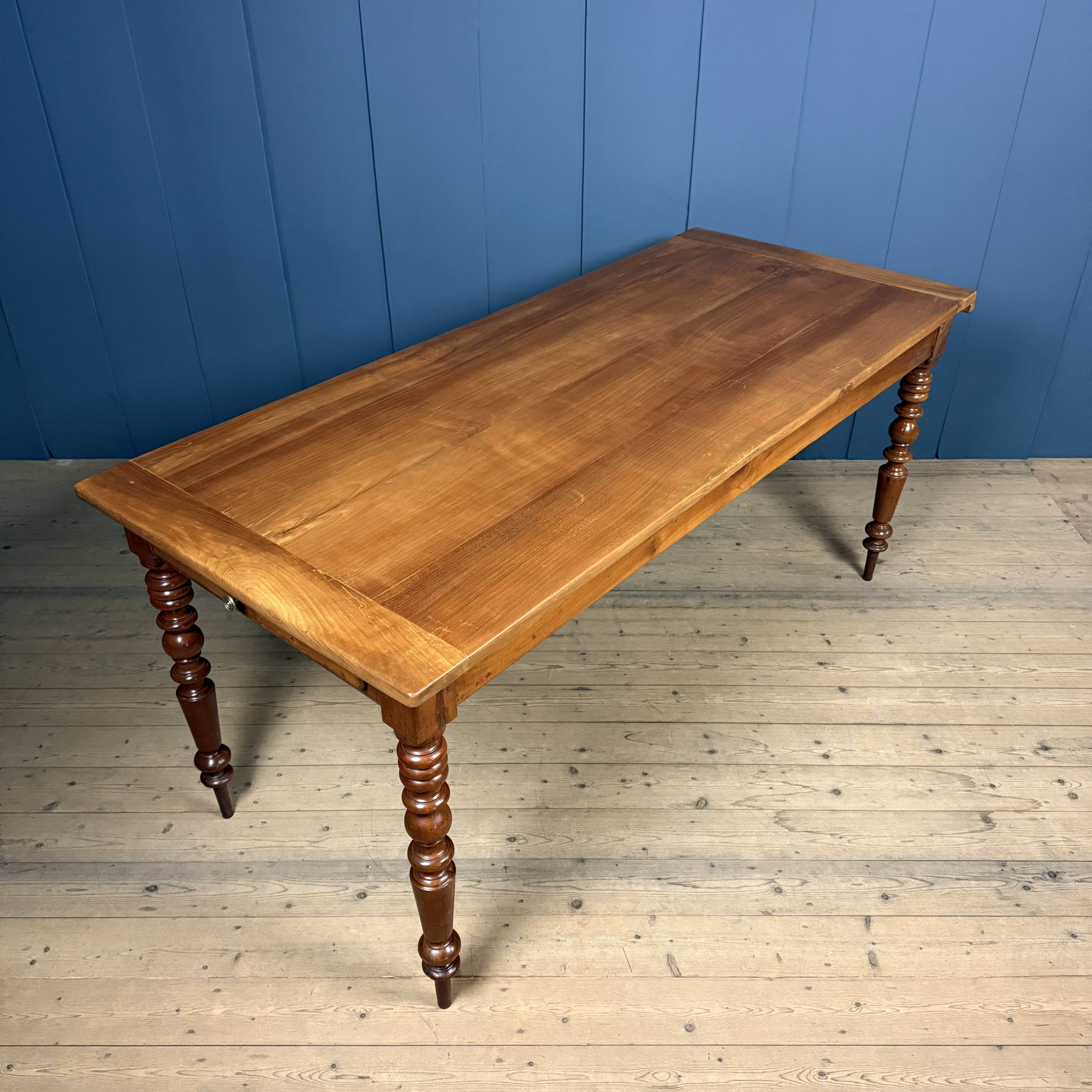 Antique cherry wood dining table from France.