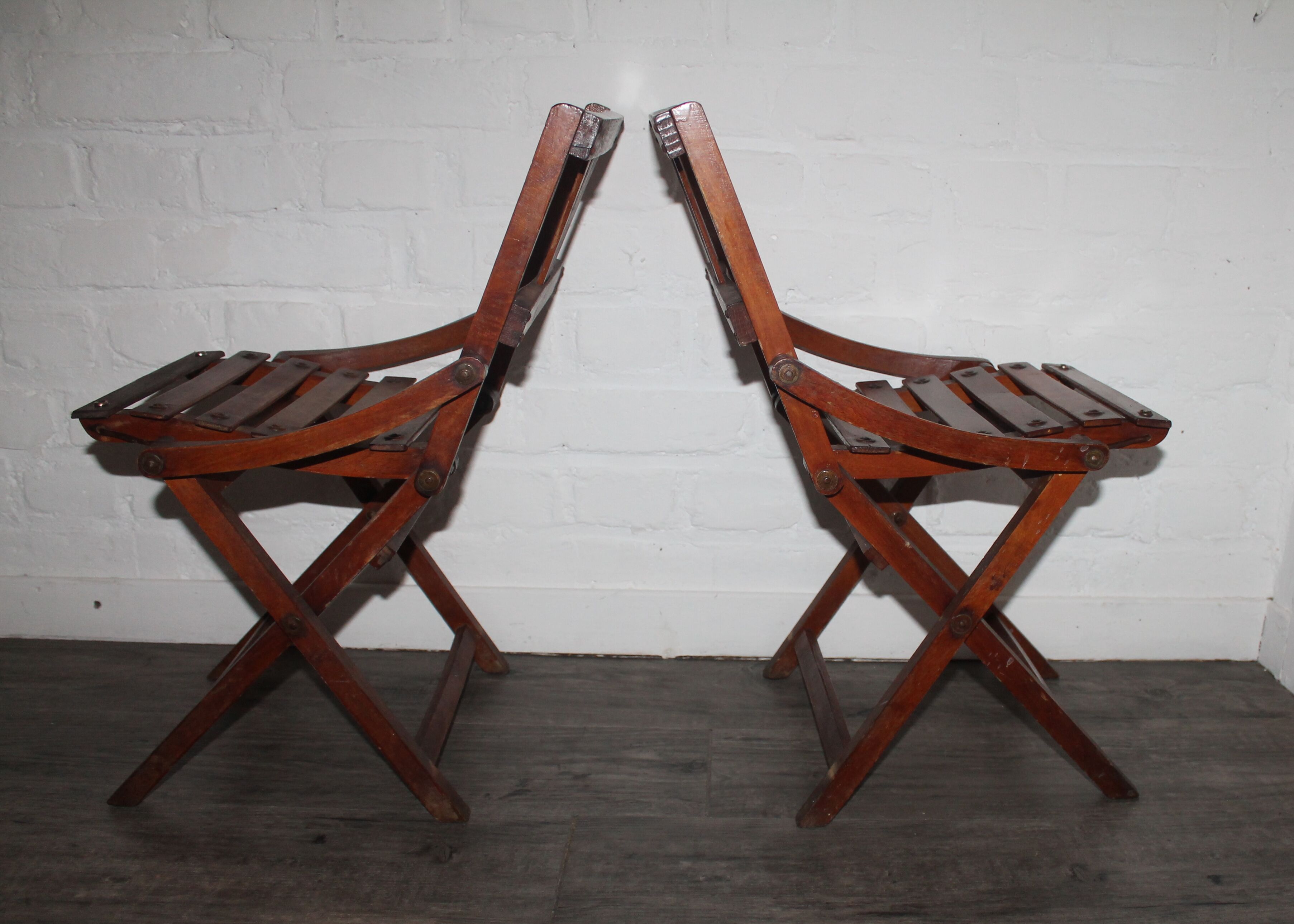 2 wooden folding chairs