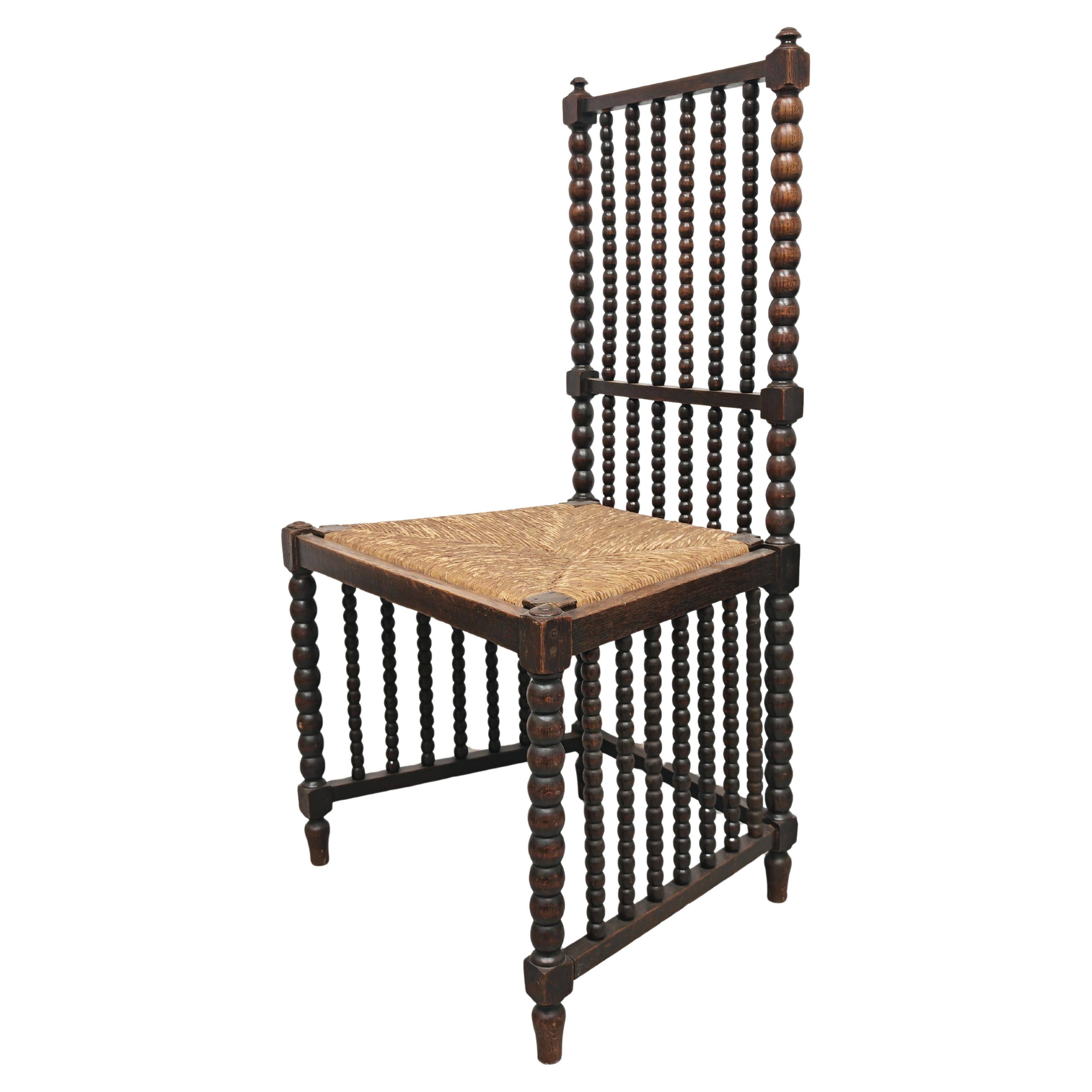 Antique High Back Bobbin Chair in Oak with Straw Seat, 1900s