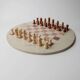 Vintage 1980s round chess set in marble, with a beige and pink marble board and wooden pieces.
