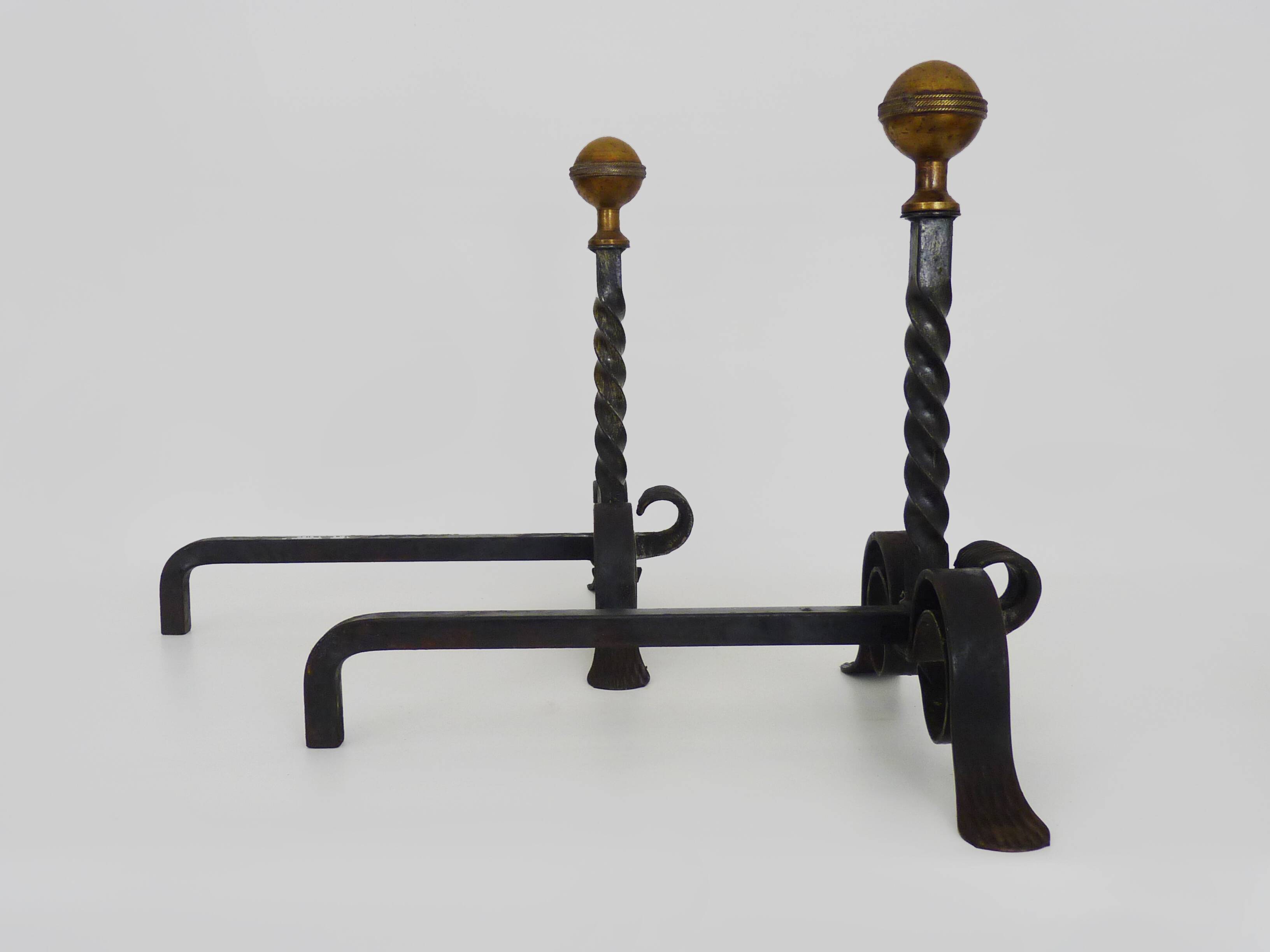 Large pair of wrought iron and brass ball fireplace andirons. 19th century