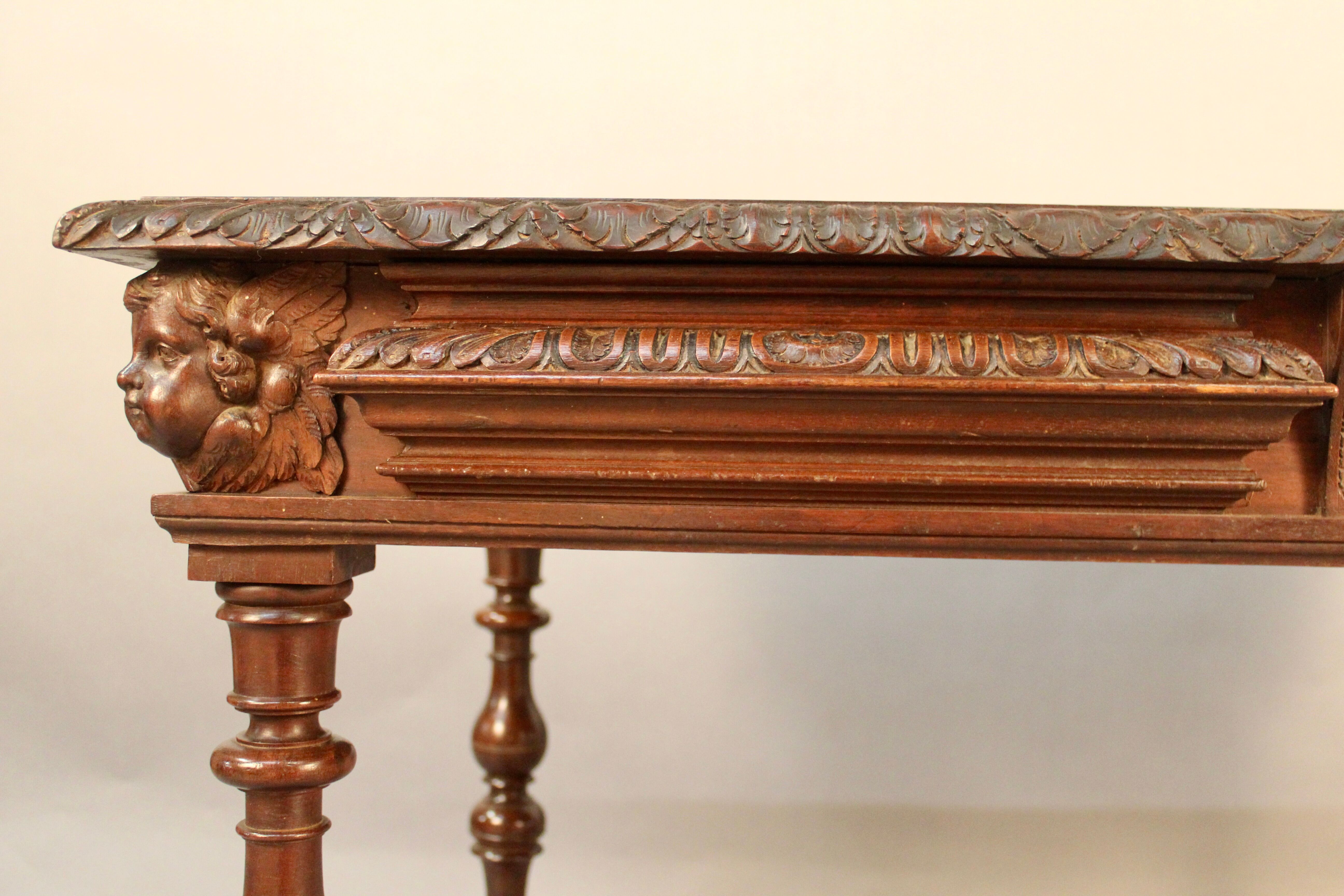 Louis XIII style writing table with Putti decoration