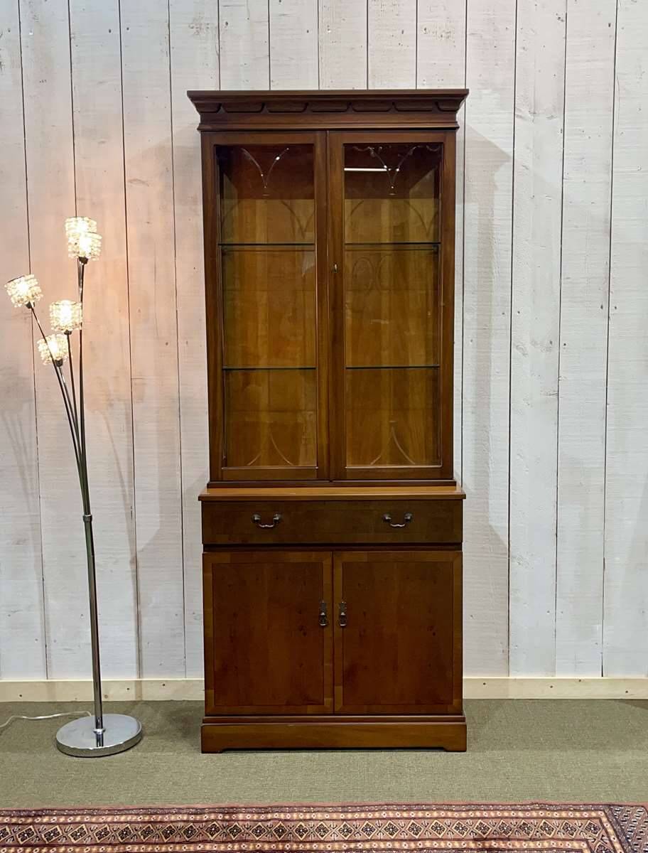 English display cabinet with two sections made of yew from the 1980s.