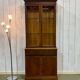 English display cabinet with two sections made of yew from the 1980s.