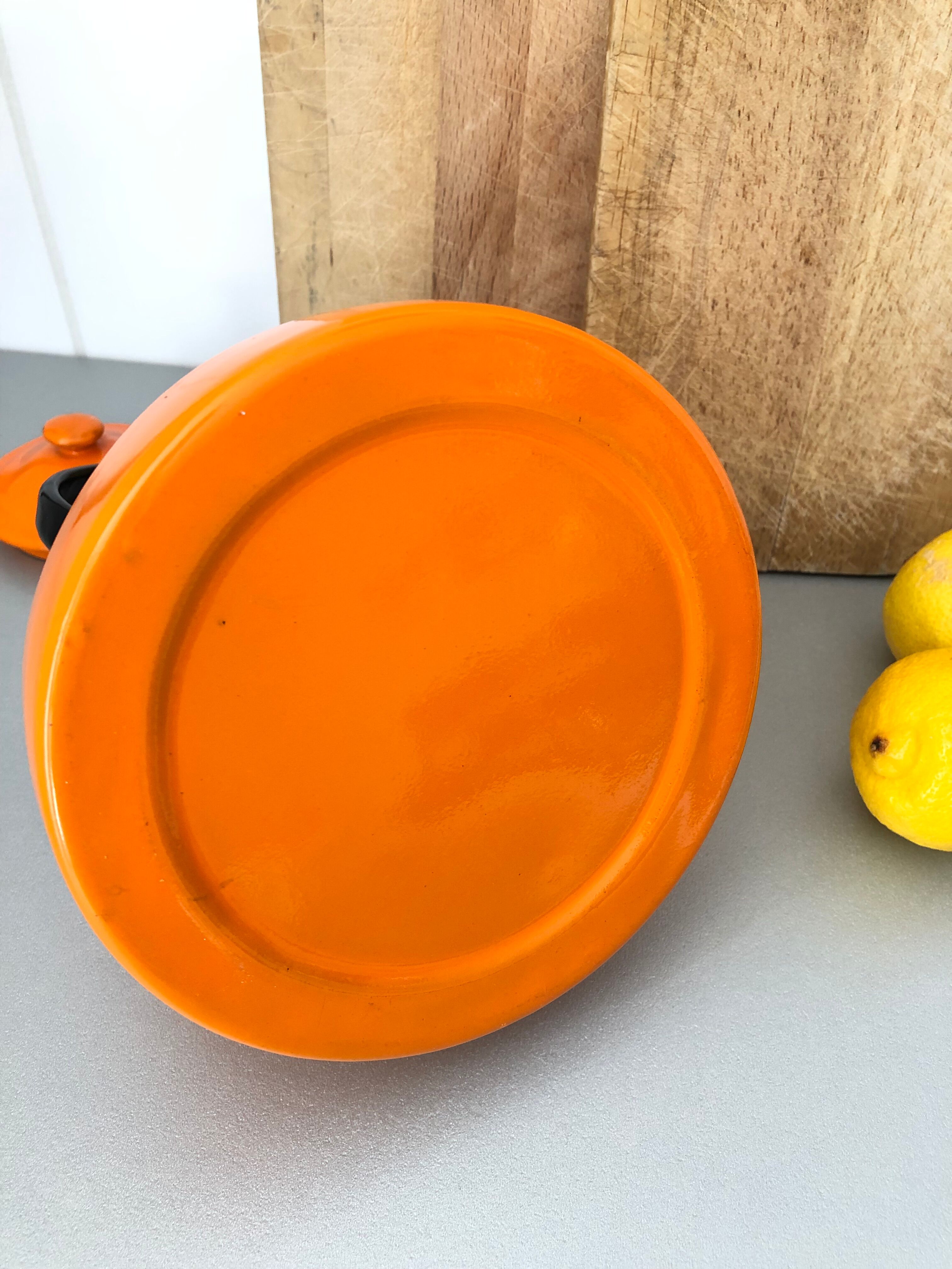 Orange enamelled kettle