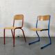 Set of 2 mismatched industrial school chairs