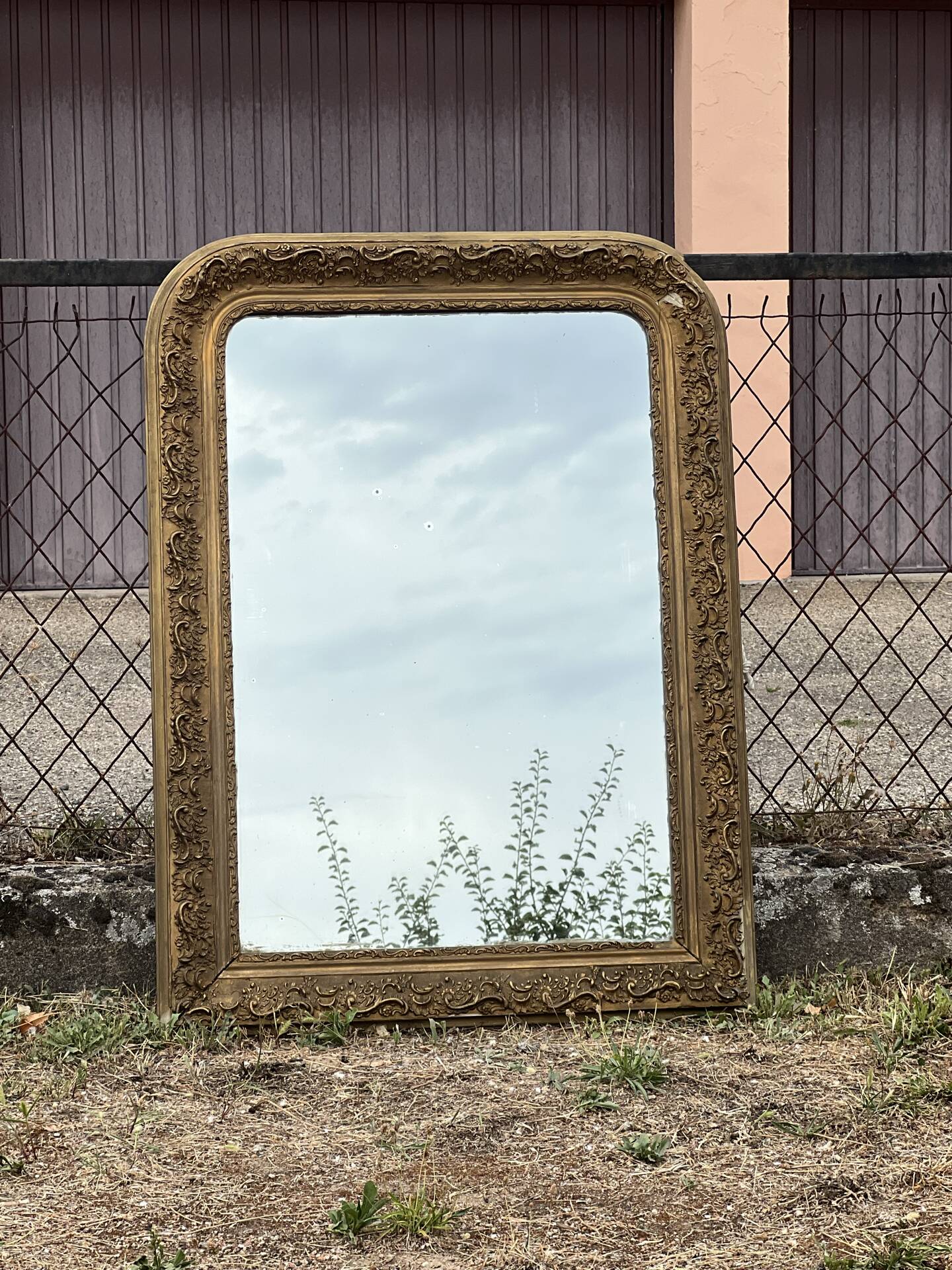 Large gilded sculpted Louis-Philippe mirror, mercury 104x77cm