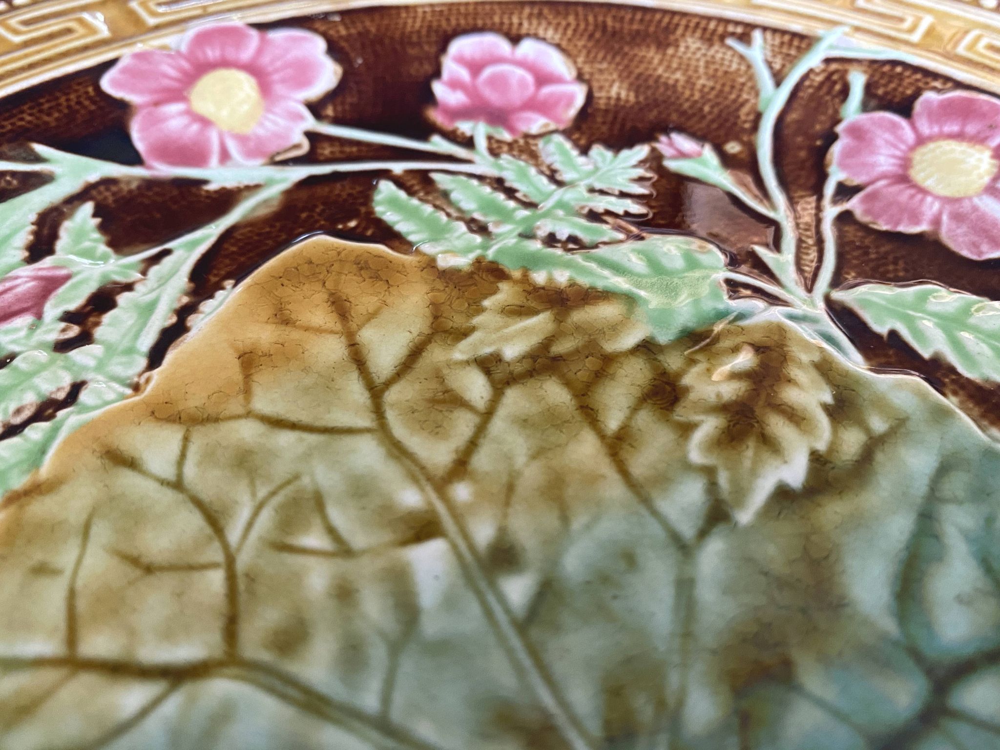 Antique plate from the Choisy Le Roi collection in slip with foliage and flowers