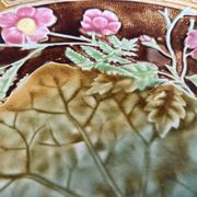 Antique plate from the Choisy Le Roi collection in slip with foliage and flowers