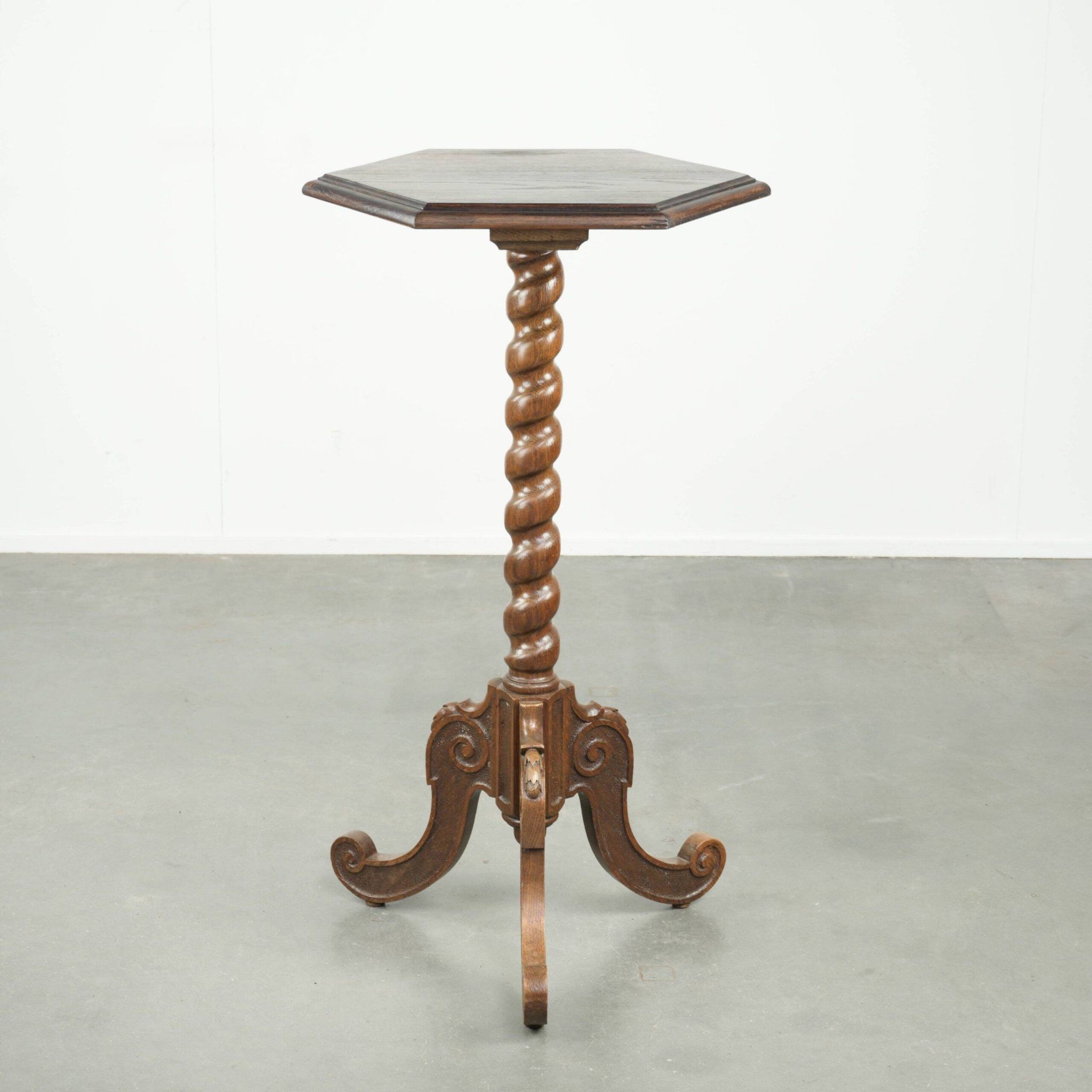 Antique tall oak plant/side table with wood carving and a turned leg