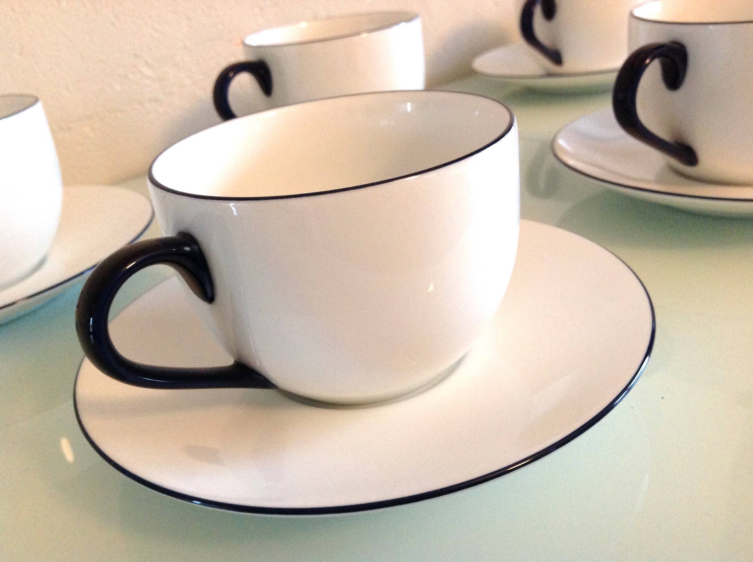 Set of eight white porcelain cups with blue edging / vintage 70s-80s