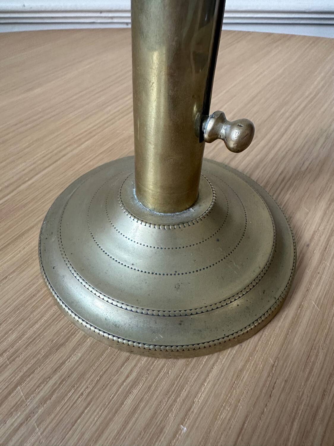 Old brass pull candle holder