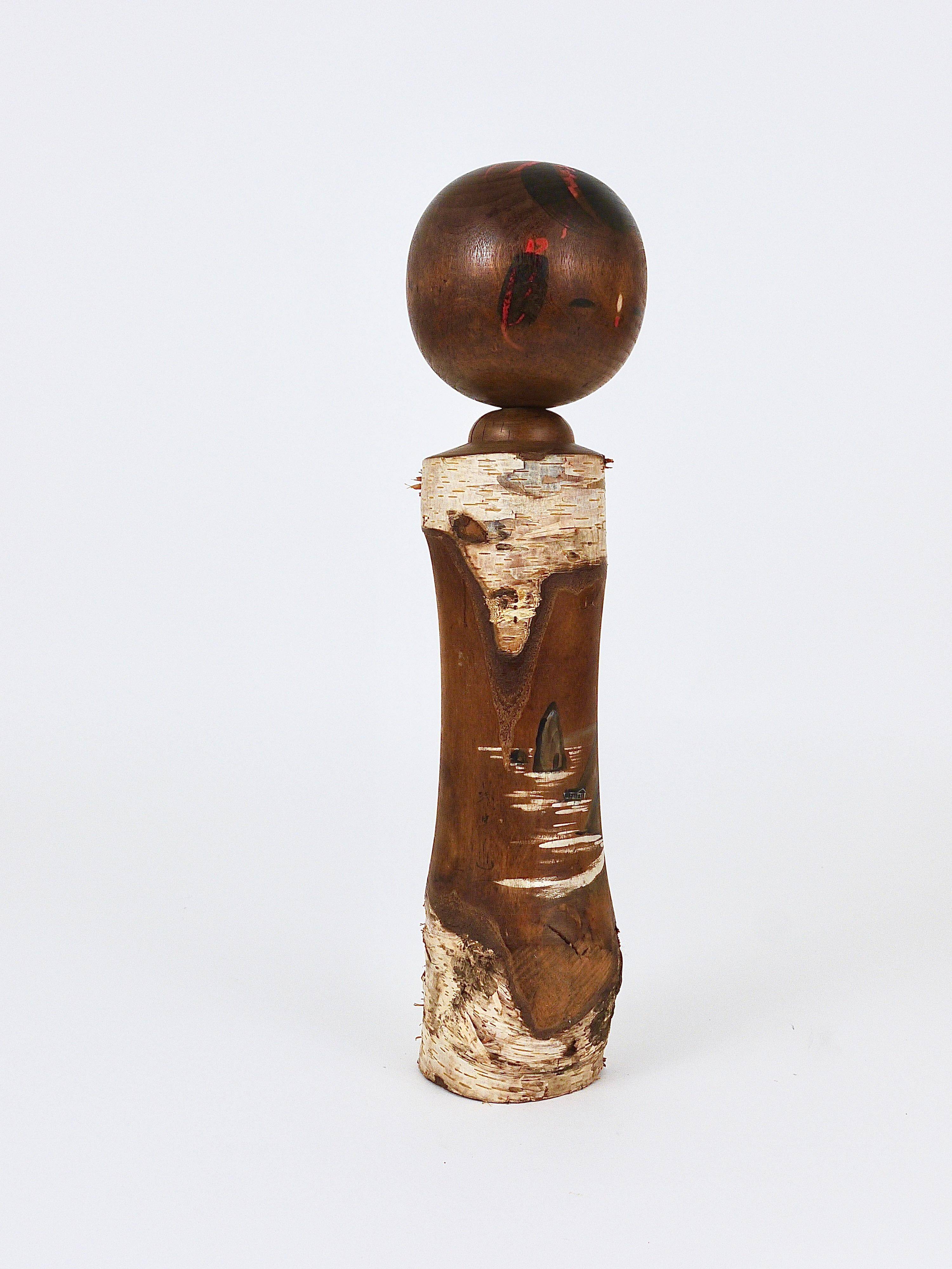 Decorative Kokeshi doll sculpture from northern Japan, hand-painted.