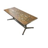 Vintage ceramic coffee table with a chrome frame.