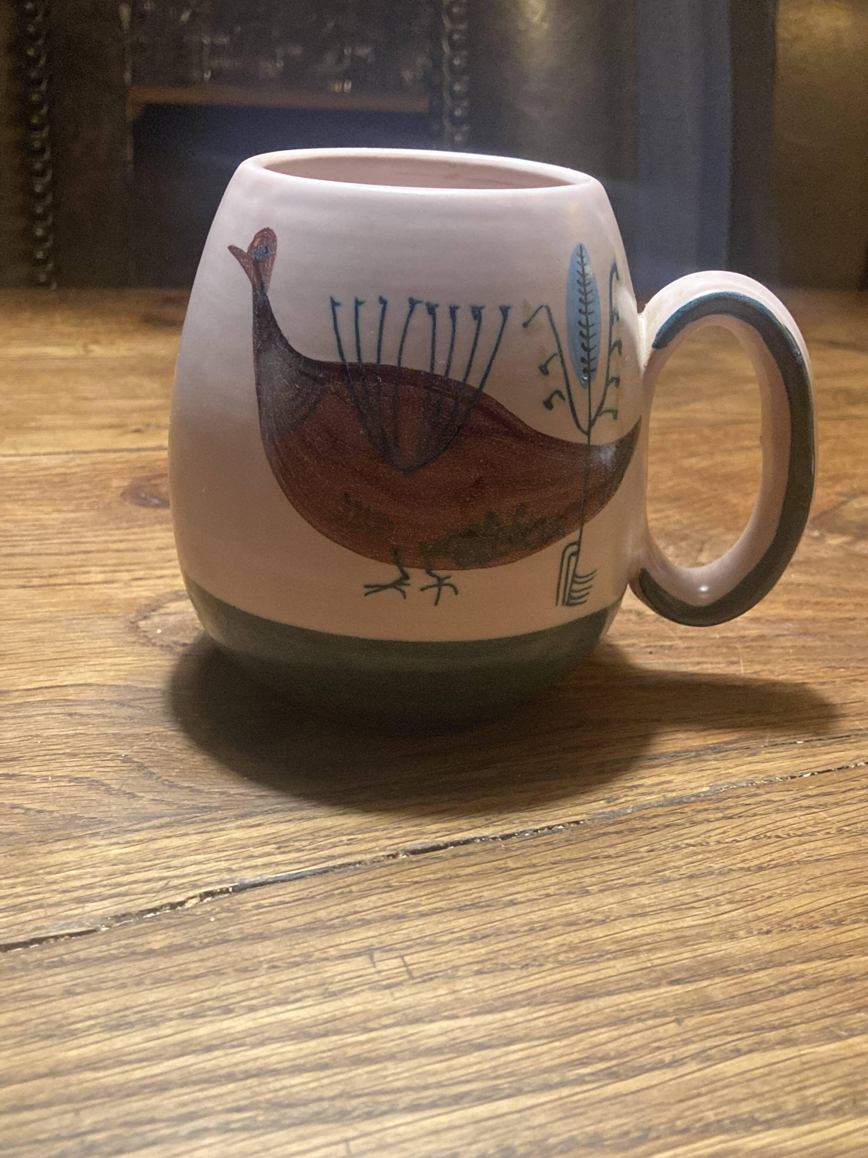 Set of two ceramic mugs signed Yvon ROY