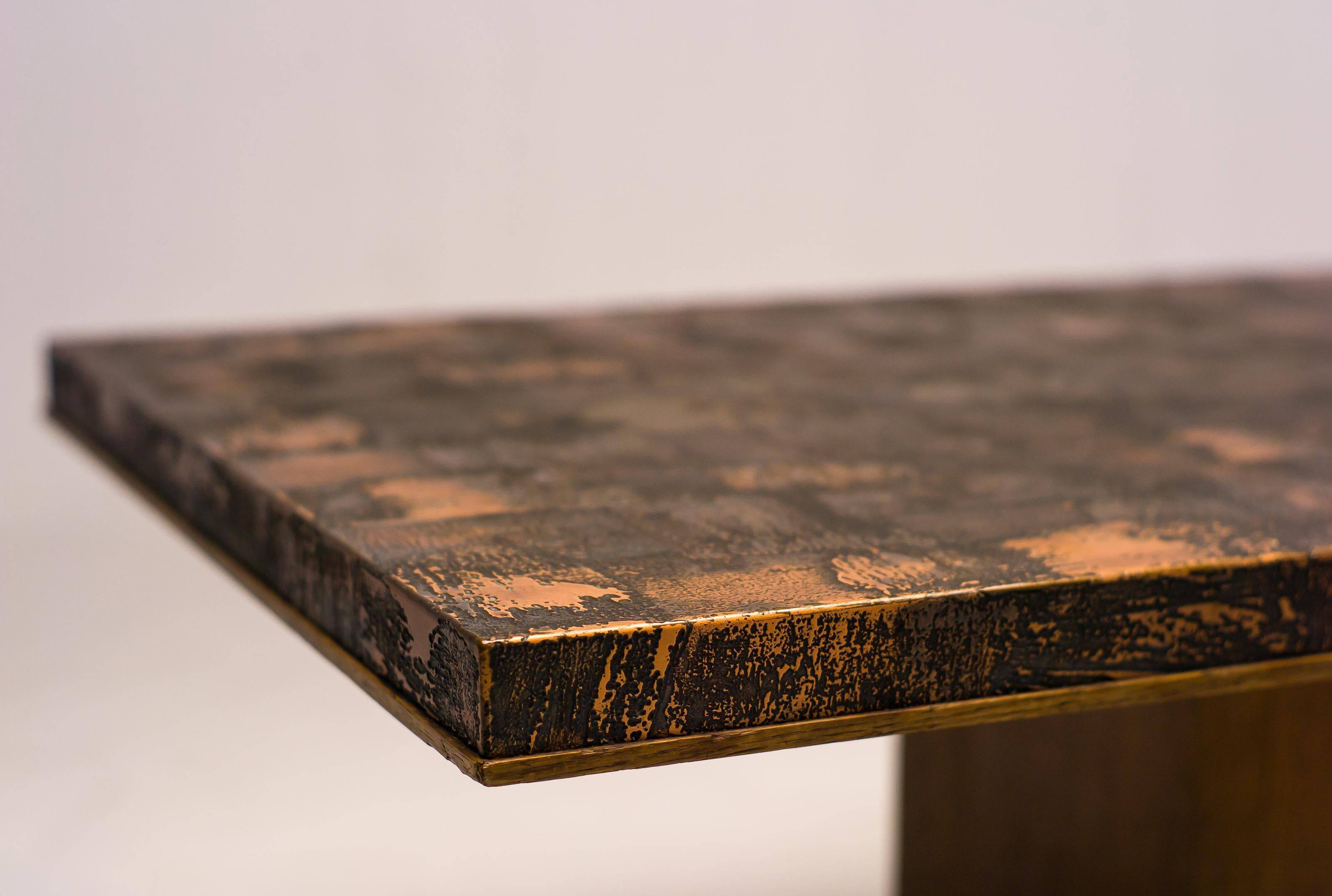 Coffee table with a pressed and engraved brass top by Illum Wikkelsø.