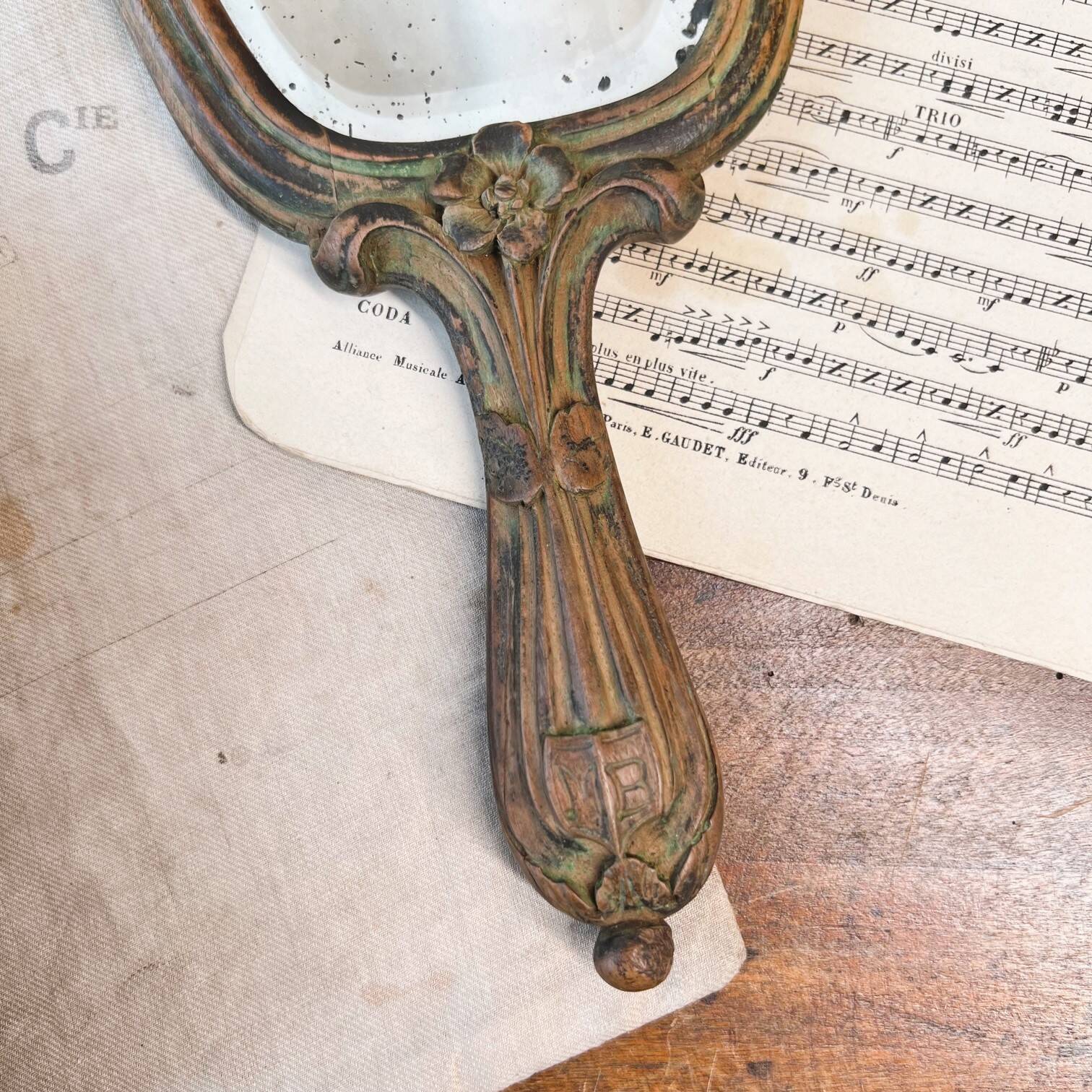 Wooden “hand-held” mirror with MB initials