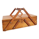 Small wooden sewing worker