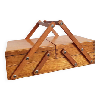 Small wooden sewing worker