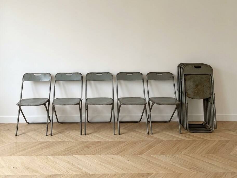 Set of 10 vintage industrial metal folding chairs.