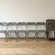 Set of 10 vintage industrial metal folding chairs.
