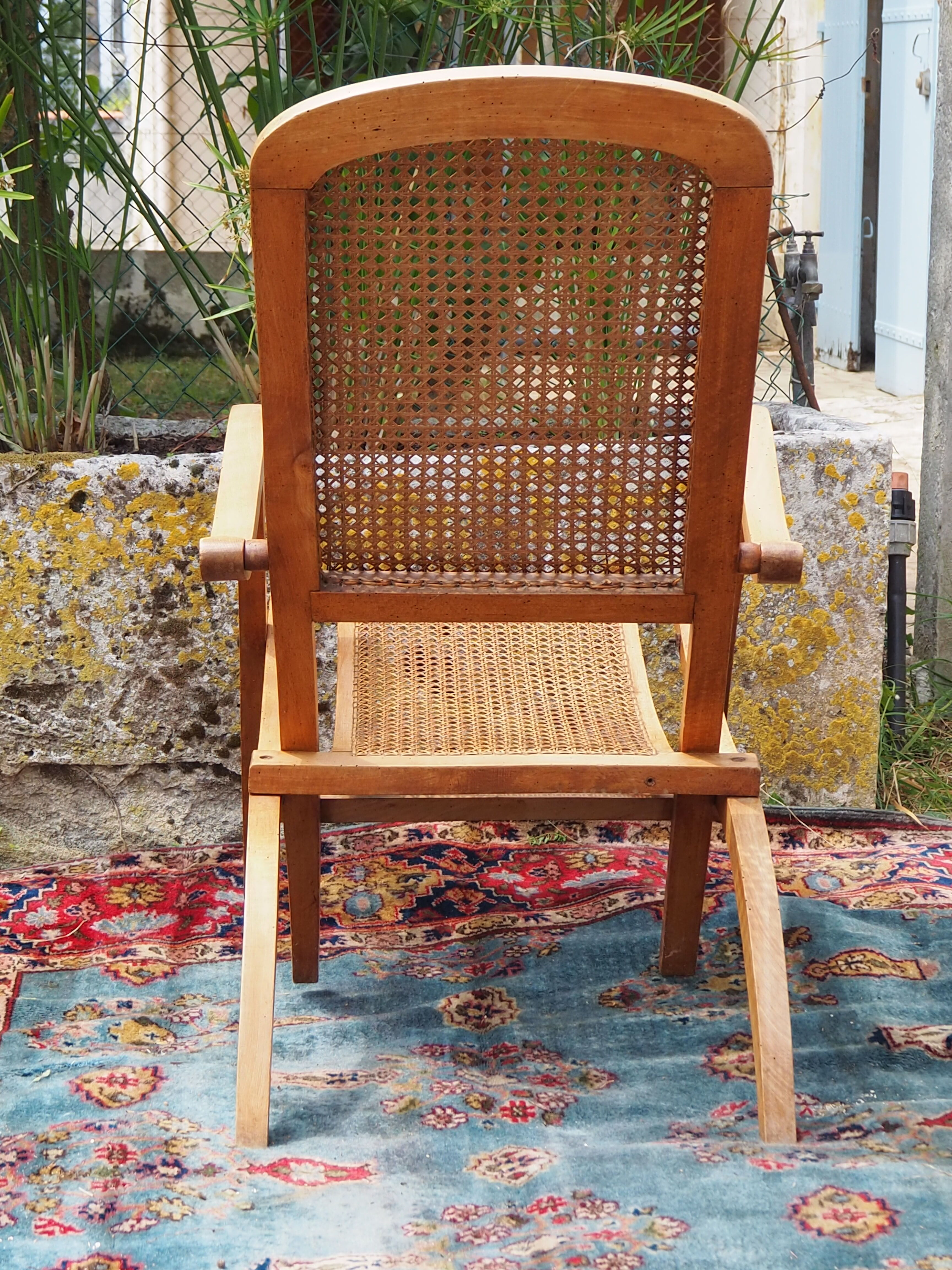 Cane folding armchair in solid wood