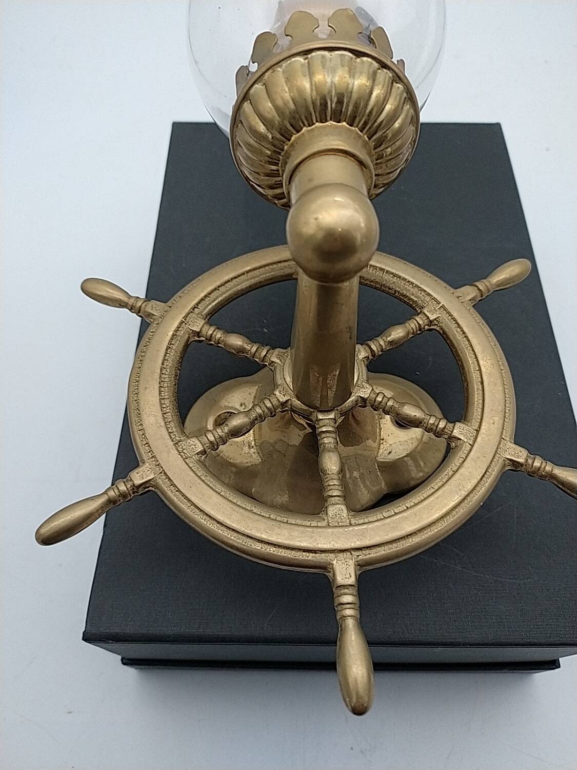 Brass wall sconces with nautical decor