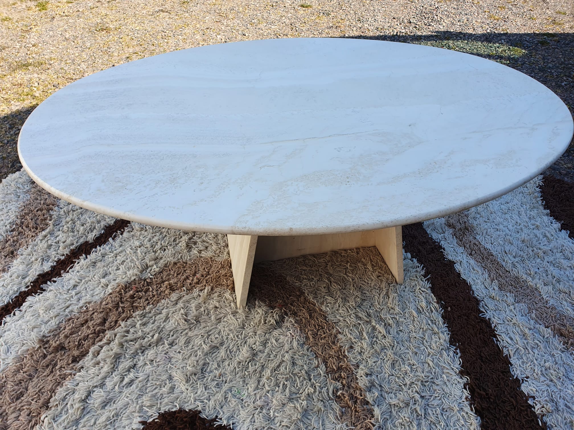 Oval travertine coffee table