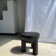 Black mango wood tripod side table with a semi-spherical top, height: 45 cm, diameter: 44 cm.