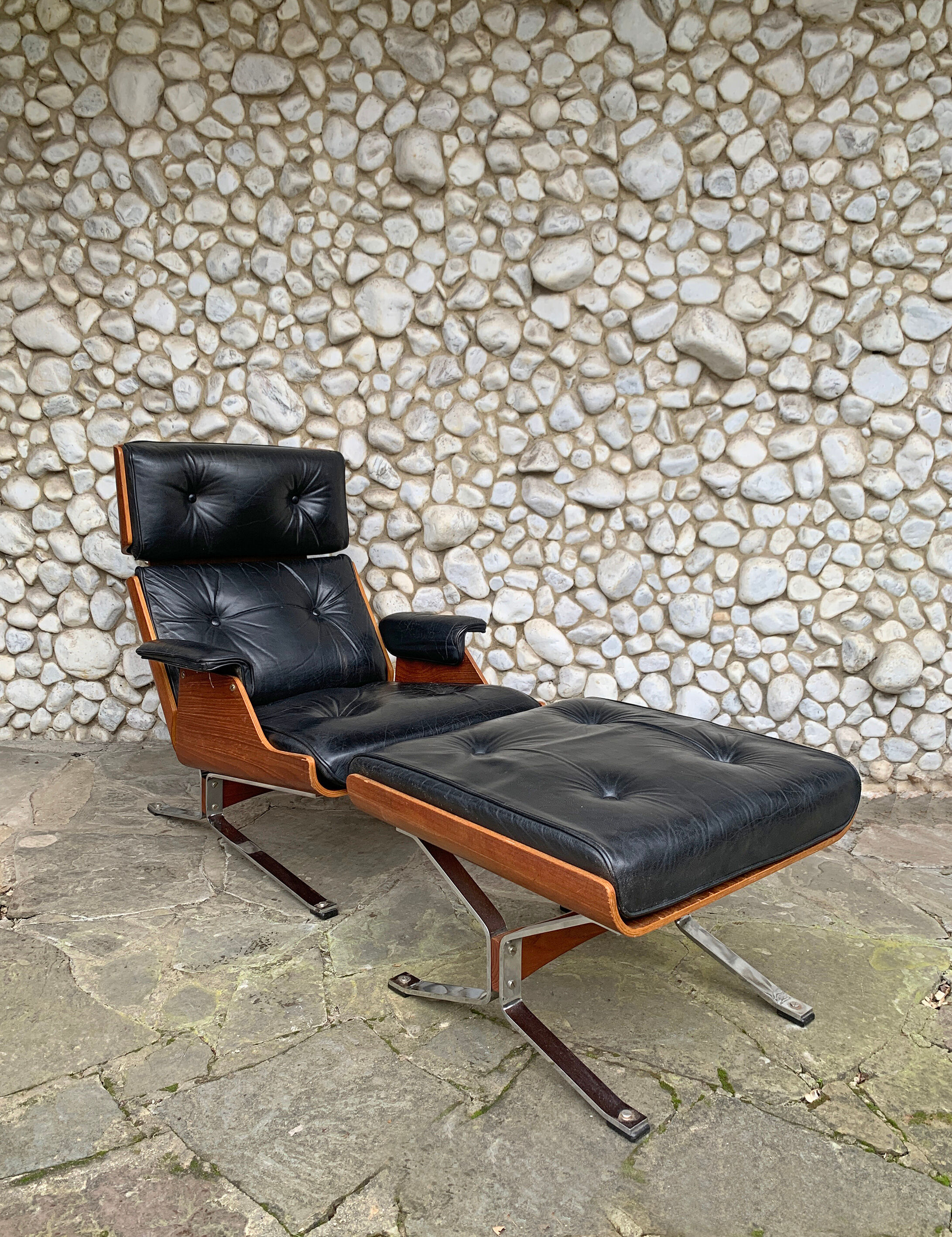 Lounge chair and ottoman black leather and teak multiplex, 1960