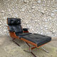 Lounge chair and ottoman black leather and teak multiplex, 1960