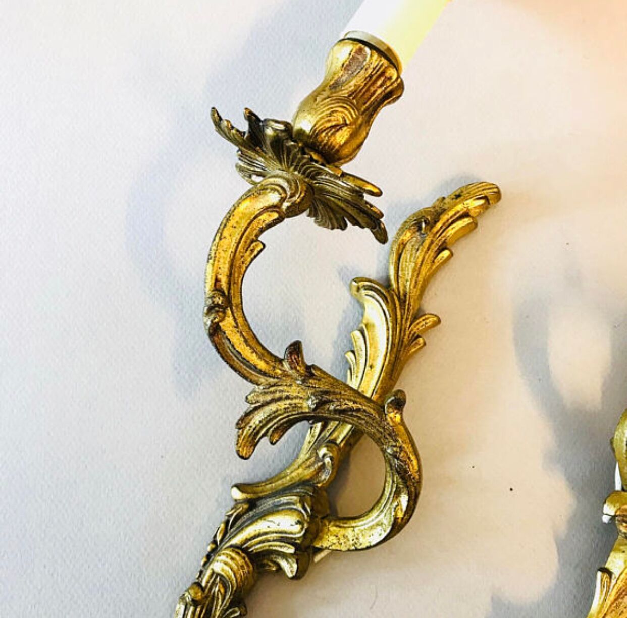 A pair of rococo gilded wall lights