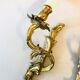 A pair of rococo gilded wall lights