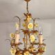 Vintage gilded hand-forged Florentine ceiling light with porcelain roses.