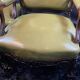 Paire de larges fauteuils XIXe en cuir vert de style Louis XV
