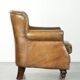 Robust cowhide armchair in a beautifully subtle size with a wonderful patina.