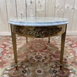 Table basse ovale de style Louis XVIen laiton et marbre