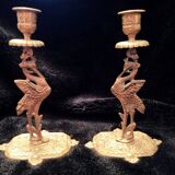 Pair of bronze candle holders decorated with herons