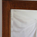 Beveled mirror grooved wood
