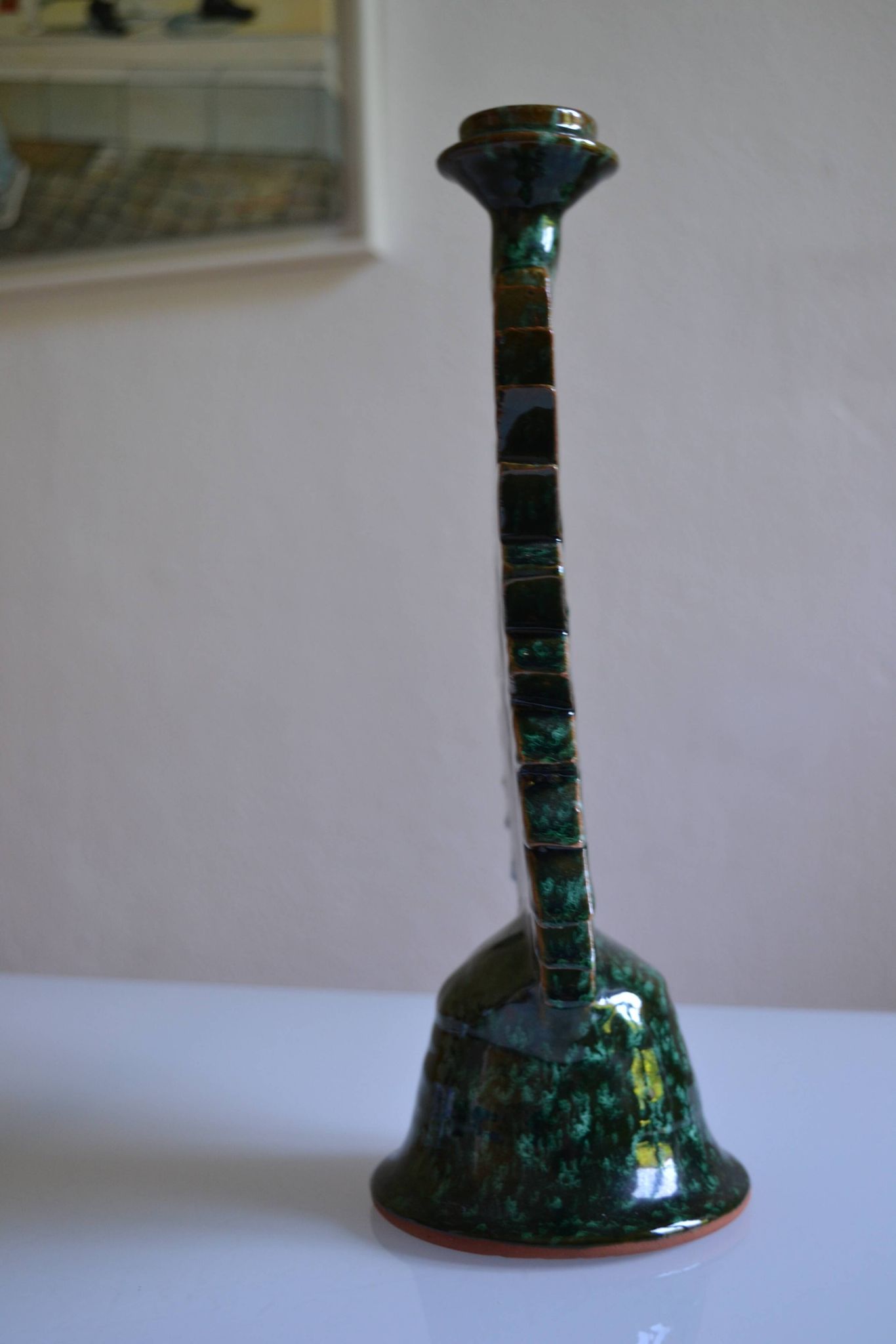 Green ceramic sun candlestick from Tamegroute, Morocco.