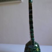 Green ceramic sun candlestick from Tamegroute, Morocco.