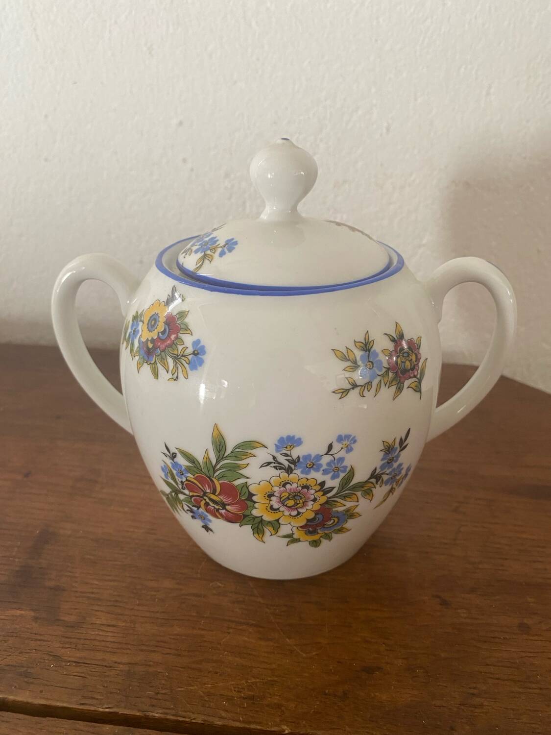 Large sugar bowl with floral porcelain.