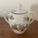 Large sugar bowl with floral porcelain.