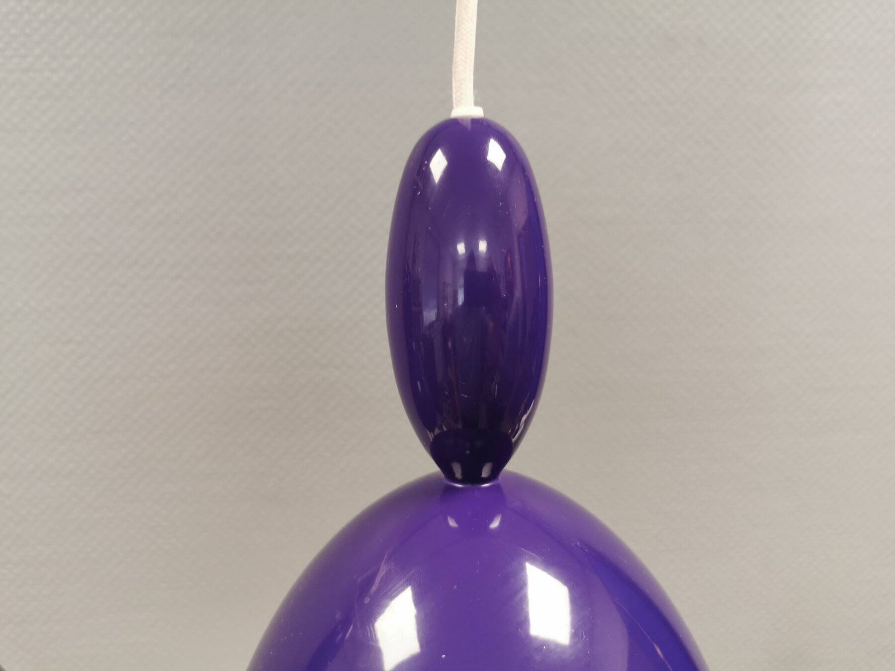 Two purple hanging lamps from Norway Says for Muuto, model Mhy