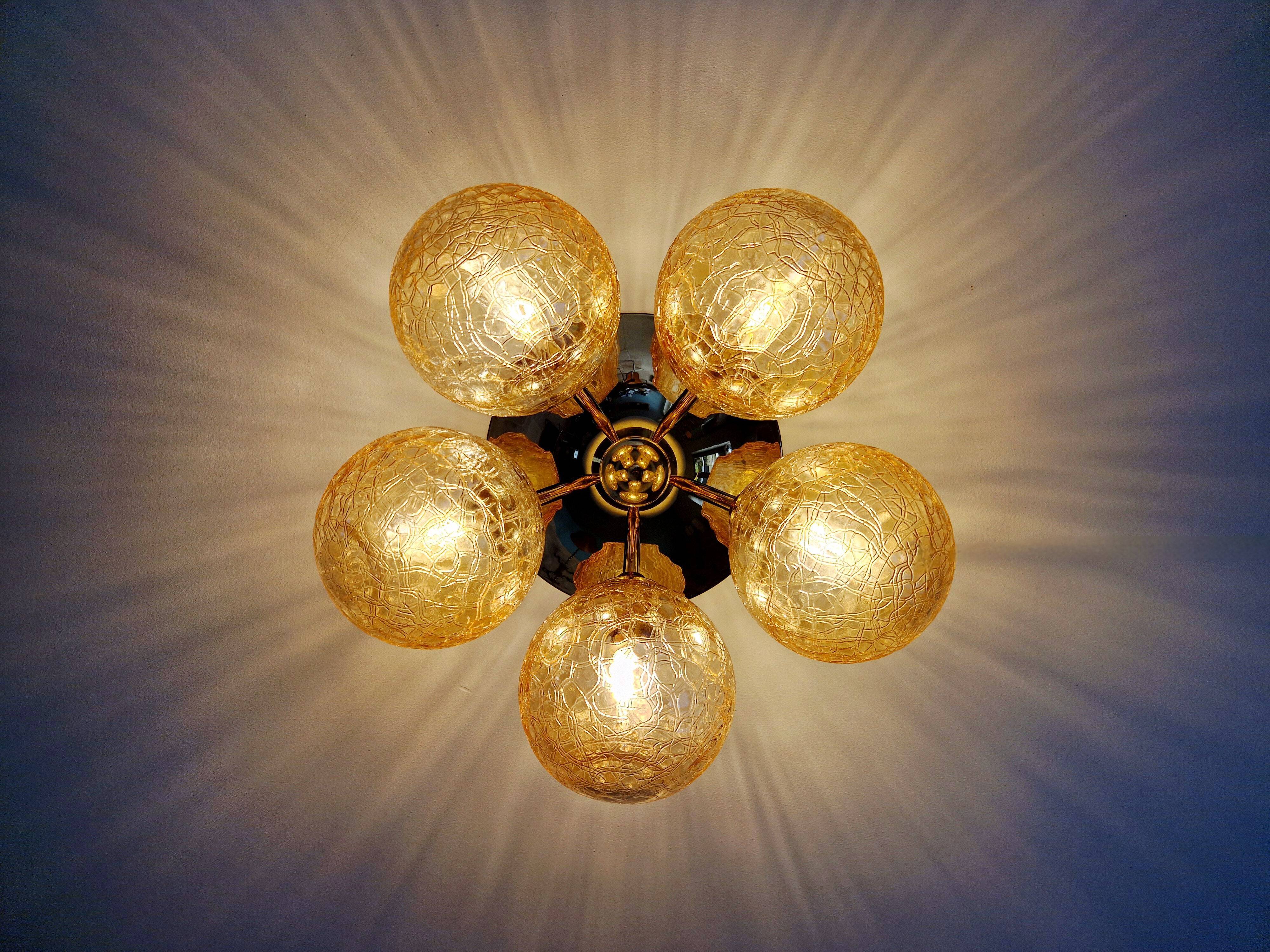 Large designer ceiling light in brass and amber crackled glass, 1970s.