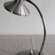 Articulated bedside lamp or wall light in aluminium, France circa 1960.